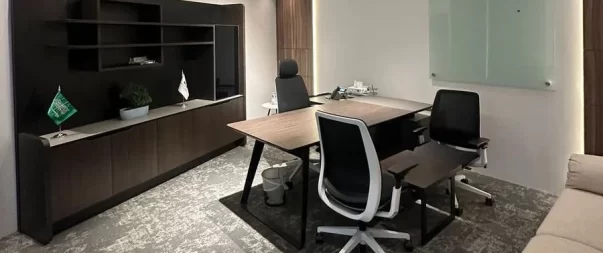 Elegant workspace with desks, chairs, and decorative touches.